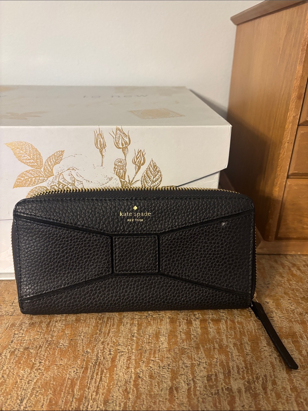 kate spade Black Pebbled Leather Bow Zip Around Wallet with Gold Accents
